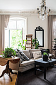Dark, vintage-style furniture in living room of period building