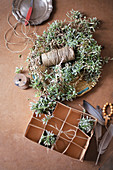Handmade chickweed Easter nest with twine, egg box and feathers