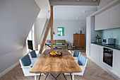 Simple fitted kitchen and dining area in open-plan interior