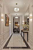 Luxurious hallway with marble floor and panelled walls