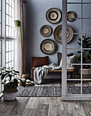 Basket bowls on the gray wall above the bench with pillows