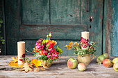 Autumnal arrangement of candles and flowers