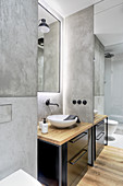 Industrial-style bathroom with grey walls and large mirror