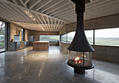 Free-standing fireplace in minimalist architect-designed house