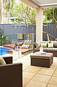 Lounge furniture on the covered terrace by the pool