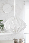 Handmade lamp made from folded wallpaper