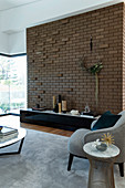 Brick wall with cantilevered stones in the living room