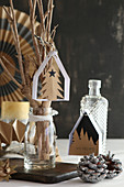 Handcrafted paper Christmas decorations: small houses, fir tree and for forest