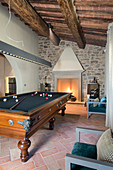 Billiard table in living room of Mediterranean house
