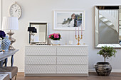 Chest of drawers with structured fronts in elegant living room