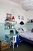 Two-tone walls in boy's bedroom in shades of blue