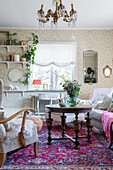 Old furniture and Oriental rug in Granny-chic living room