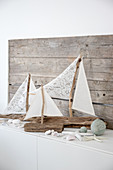 Sailing boat ornaments made from driftwood and fabric remnants