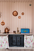 Children's kitchen in play house with pink walls
