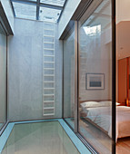 Minimalist bedroom with glass wall