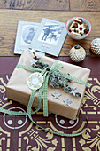 Gift rustically wrapped and decorated with sealing wax and lichen-covered branch