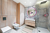 Modern bathroom with wood panelling and square ceramic sink