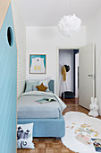 Small child's bedroom in pale blue and white