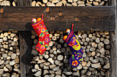 Handmade Christmas stockings decorated with colourful felt motifs