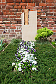 Grave design with horned violets and pansies