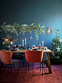 Garland of eucalyptus branches above festively set table