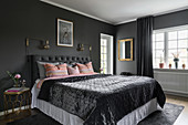 Opulent grey bedroom with gold accents