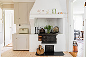 Old wood-fired cooker in Scandinavian country-house kitchen