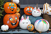 Handcrafted Halloween decorations: pumpkins with various faces