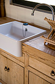 Kitchen counter with wooden doors and sink