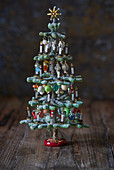 Tiny decorated Christmas tree ornament