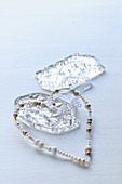 Threaded beads in heart shape and glass prisms
