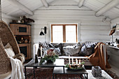 Cosy winter ambience in rustic living room of log cabin