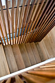 Stairwell with slatted wooden wall