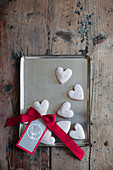 Heart-shaped iced biscuits and gift tag