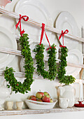 Lettering 'JUL' made from boxwood branches as a Christmas decoration