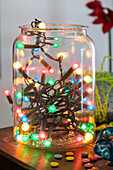 Colorful fairy lights in a glass jar