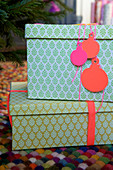 Homemade gift tags in the shape of a Christmas tree ornament made of paper