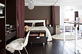 Elegant bedroom in brown tones in a loft apartment