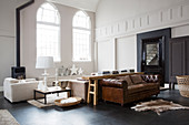 Living room in earthy shades in converted church nave