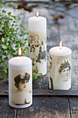 White pillar candles pasted with nostalgic photos