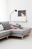 Pale grey chaise sofa in white living room
