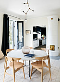 Round table in the bright Scandinavian style dining room