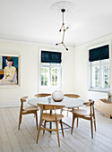 Round table in the bright Scandinavian style dining room