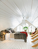 Bedroom in white under the sloping roof