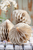 Paper ornaments made from old folded book pages