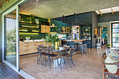 Large, open-plan industrial-style interior in grey and green
