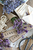 Bunch of lavender in paper cone, folded envelopes and stamped paper signs