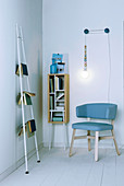 Books on shelves and ladder and DIY reading lamp in reading corner