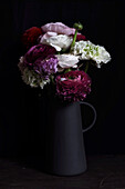 Bouquet of ranunculus in a pitcher