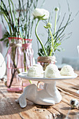 White coconut biscuits on cake stand with rabbit-shaped base